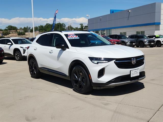2023 Buick Envision Essence in Summit White — front three-quarter view